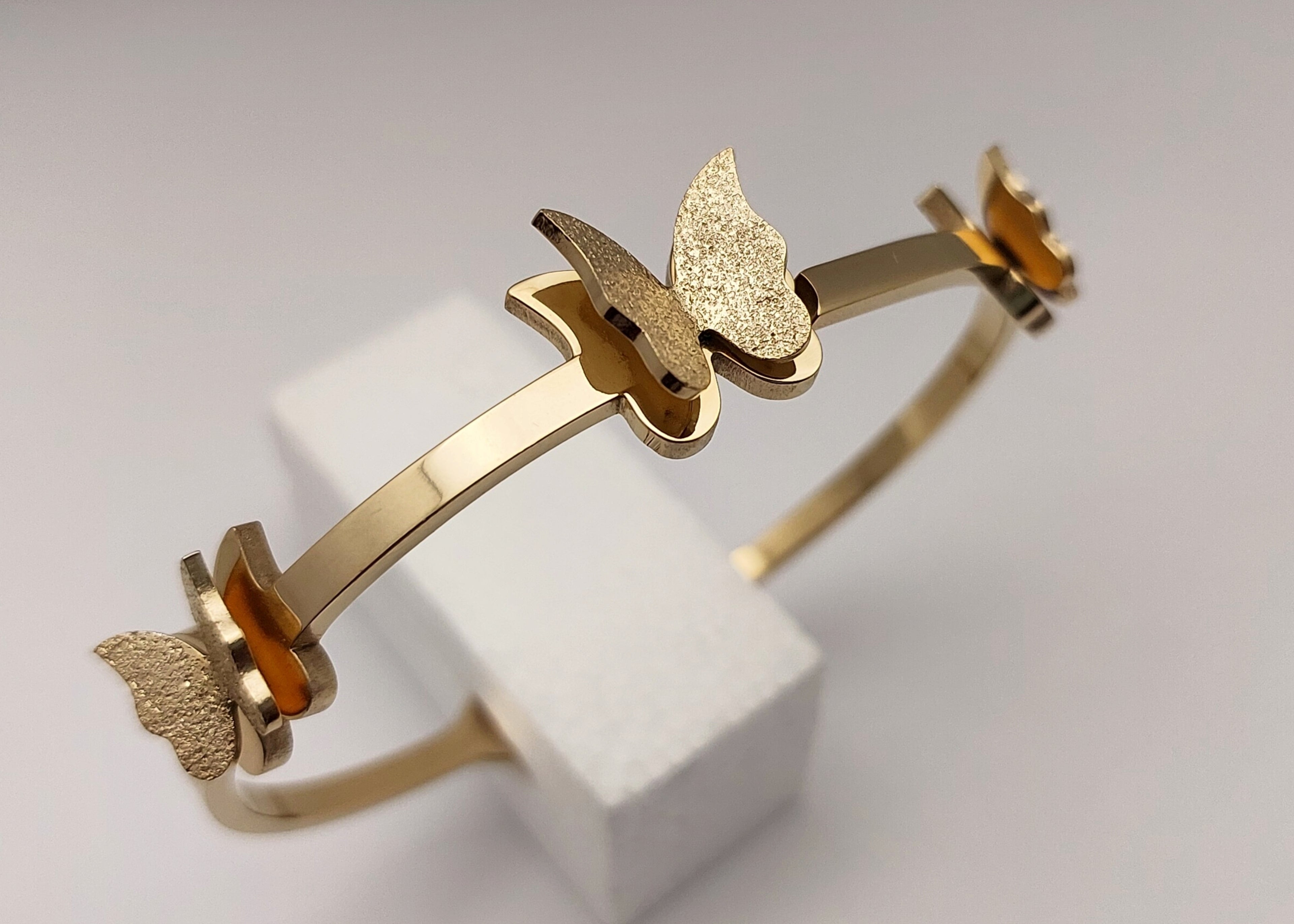 Gold toned Butterfly Charm handcuff bracelet