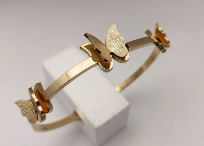 Gold toned Butterfly Charm handcuff bracelet