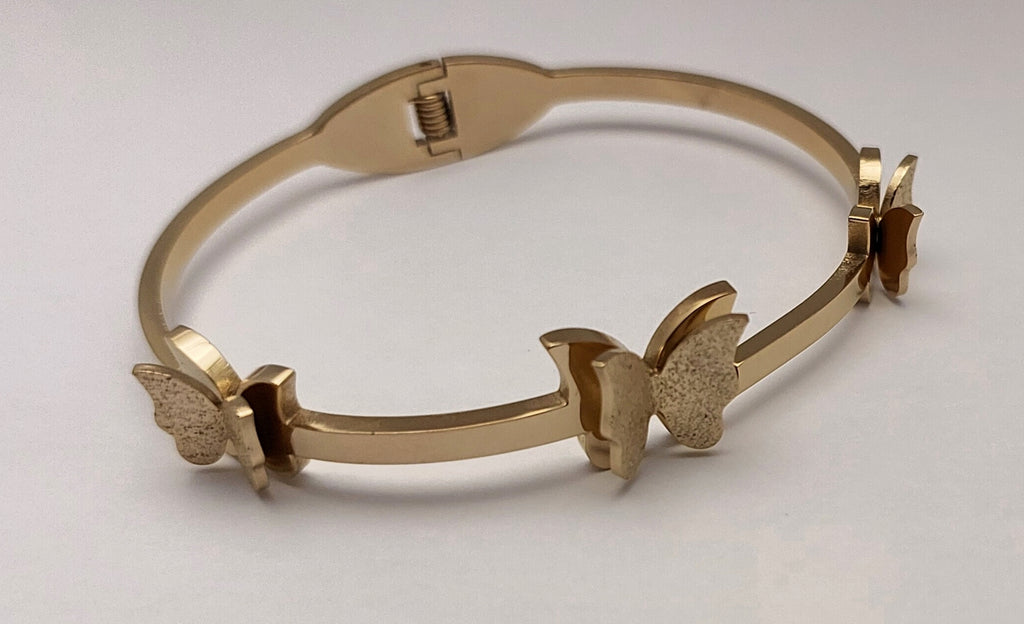 Gold toned Butterfly Charm handcuff bracelet